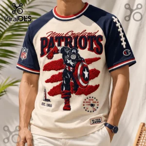 New England Patriots x Captain America vintage embroidered shirt featuring team colors, a lighthouse, and hero graphics.