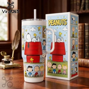 Peanuts Snoopy and Friends 40oz Stanley Tumbler featuring Snoopy on his red doghouse with Woodstock and the cartoon cast.
