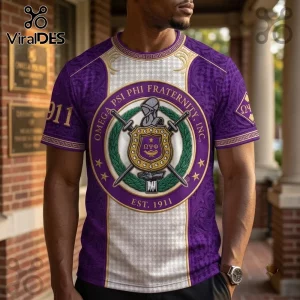 Omega Psi Phi Fraternity Purple Crest T-Shirt featuring a central ornate shield, swords, and 1911 text on a patterned fabric.