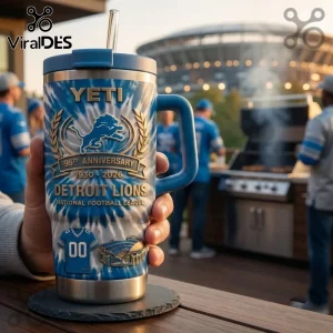 Detroit Lions 96th Anniversary Tie Dye YETI Tumbler with blue and white swirl patterns and team branding held by hand.