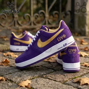 Omega Psi Phi Purple Suede Air Force 1 Sneakers featuring gold swoosh, white laces, and Greek letters on a stone surface.