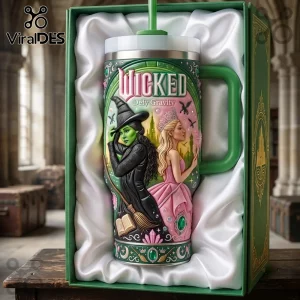 Wicked Defy Gravity Stanley Tumbler 40oz featuring Elphaba and Glinda in a green and pink gift box with satin lining.