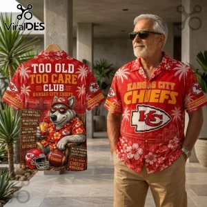 Kansas City Chiefs Mascot Red Tropical Hawaiian Shirt featuring a wolf graphic, palm trees, and team text on a hanger.