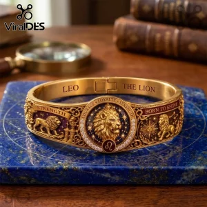 Lion Strength Horoscope Gold Bracelet featuring an embossed lion head, star motifs, and inscribed text on a blue stone base.