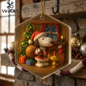 Snoopy and Woodstock Christmas Ornament 2026 featuring a 3D Santa Snoopy with a gift sack and Woodstock near a tree.