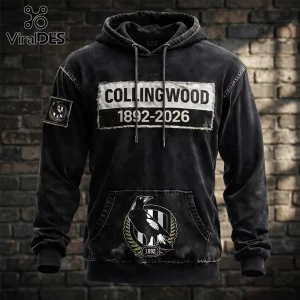 Collingwood Magpies 1892-2026 Distressed Black Hoodie with a white chest patch, kangaroo pocket, and team emblem.