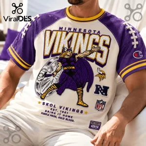 Minnesota Vikings Embroidered Mascot Champion Shirt featuring purple and cream raglan sleeves with graphic Viking warrior.