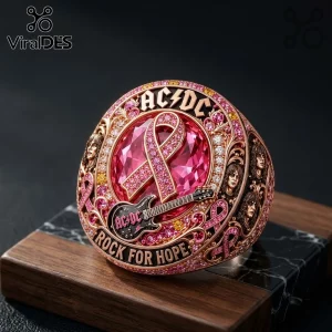 AC/DC Rock For Hope Breast Cancer Awareness ring with a pink crystal, ribbon motif, and band member portraits.