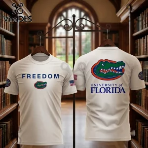 University of Florida Freedom White T-Shirt displaying an alligator logo on the chest and back in a library setting.