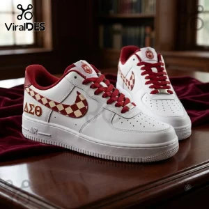 Delta Sigma Theta Nike Air Force 1 Sneakers featuring white leather, red laces, a checkered swoosh, and Greek lettering.
