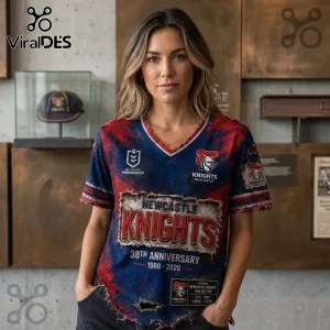 Newcastle Knights 1988-2026 Anniversary Distressed Shirt featuring red and blue worn fabric with team logo and text graphics.