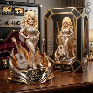 Dolly Parton 80th Anniversary Gold Acrylic Plaque featuring a figurine of the singer, a guitar, and a gold base.