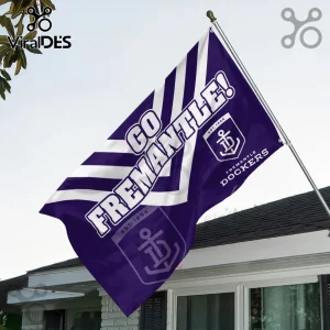 Fremantle Dockers Purple Double Sided House Flag with chevron pattern, team logo, and text flying on a white house exterior.