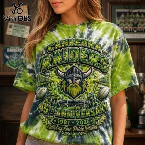 Canberra Raiders 45th Anniversary Tie Dye Shirt featuring a Viking helmet logo, stadium graphic, and green tie-dye pattern.