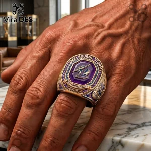 Melbourne Storm 30th Anniversary Commemorative Ring featuring a purple shield logo and gold finish worn on a finger.