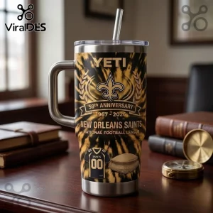 New Orleans Saints 59th Anniversary YETI Tumbler 40oz featuring a black and gold tie-dye pattern and team logo.