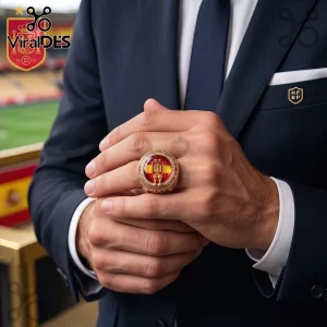 Spain National Football Championship Gold Ring featuring a central Spanish flag emblem worn on a man's finger in a suit.