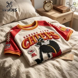Kansas City Chiefs NFL mascot embroidered shirt with red sleeves, yellow trim, and detailed team mascot applique graphic.