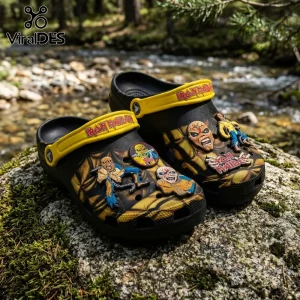 Iron Maiden Eddie Mascot Crocs Clogs Shoes featuring yellow heel straps and colorful band mascot charms on black foam footwear.
