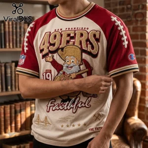 San Francisco 49ers Mascot 1946 Patch Shirt featuring a gold miner mascot, red sleeves, and vintage team graphics on cream.