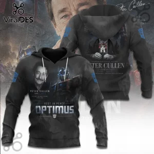 Peter Cullen Optimus Prime 1941-2026 Tribute T-Shirt in black with photo portrait, Optimus Prime, and commemorative text.