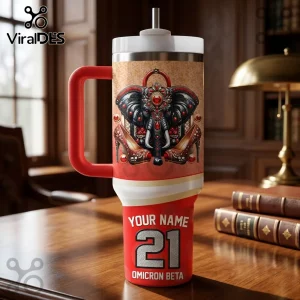 Custom Name Delta Sigma Theta Stanley Tumbler with elephant and high heel graphics, red and gold color scheme on desk.