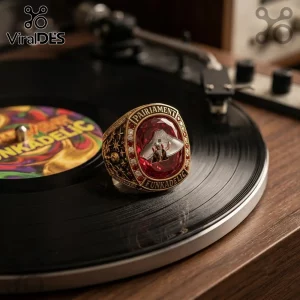 Parliament Funkadelic Mothership Red Gemstone Championship Ring featuring a silver spaceship icon on a vibrant red stone.