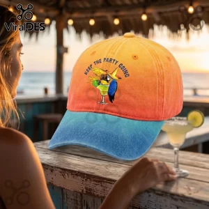 Tropical Parrot Margarita Embroidered Baseball Cap featuring a macaw holding a drink with text on an orange-blue hat.
