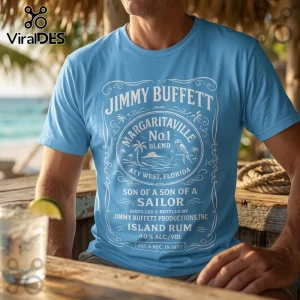 Jimmy Buffett Son of a Sailor blue t-shirt with white printed rum label graphic on a man at a beach bar.