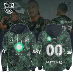New Zealand Warriors 2026 Junior Te Taiao hoodie featuring a dark green fern leaf print, NRL branding, and sponsor logos.