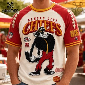 Kansas City Chiefs NFL mascot embroidered shirt featuring a cartoon wolf, red sleeves, and team logos on cream fabric.