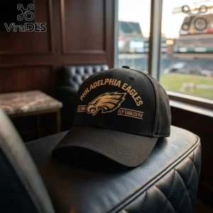 NFL Philadelphia Eagles Fly Eagles Fly baseball cap in black with metallic gold embroidered team logo and text.