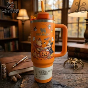 Disney Winnie the Pooh Mickey Mouse Halloween 40oz tumbler in orange with cartoon characters and jack-o'-lantern graphics.