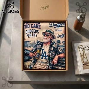 MLB Los Angeles Dodgers Palm Tree Hawaiian Shirt folded in a cardboard gift box with beach-themed baseball illustrations.
