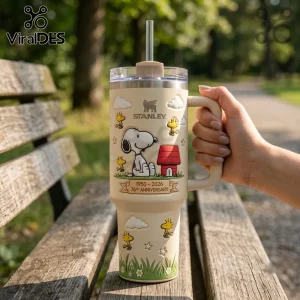 Snoopy x Stanley 76th Anniversary Cream 40oz Tumbler featuring Peanuts characters, a red doghouse, and anniversary text.
