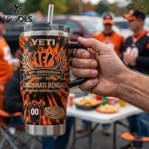 Cincinnati Bengals 59th Anniversary Stanley Tumbler with orange and black tiger stripe pattern and team logo in hand.