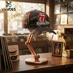 The Rolling Stones Premium Camo Baseball Cap featuring a red tongue logo and white script text on a dark camo fabric base.
