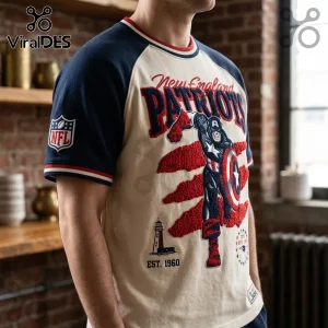 New England Patriots x Captain America vintage embroidered shirt with navy sleeves and cream torso, featuring NFL branding.