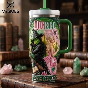 Wicked Defy Gravity Stanley Tumbler 40oz featuring Elphaba and Glinda graphics, green and pink color scheme with straw.