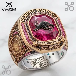 Penrith Panthers 60th Anniversary Gold Ring featuring a red stone center, black panther emblem, and stadium detailing.