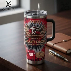 Atlanta Falcons 60th Anniversary YETI Tumbler 40oz featuring red and black tie-dye patterns and team branding on a desk.