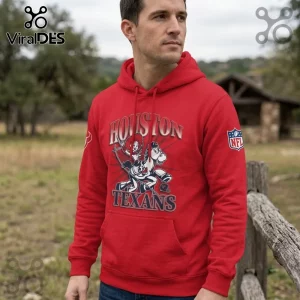 Houston Texans x Jessie Toy Story red pullover hoodie worn by a man with an NFL logo patch and western character graphic.