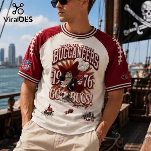 Tampa Bay Buccaneers 1976 Embossed Shirt featuring red raglan sleeves, vintage graphics, and nautical embroidery details.