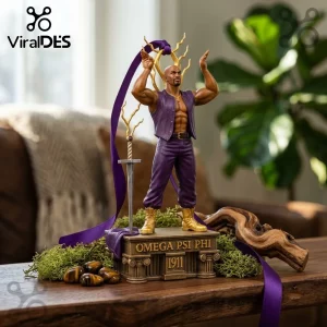 Omega Psi Phi 1911 Christmas Ornament features a male figure in purple attire standing on a gold pedestal with a sword.