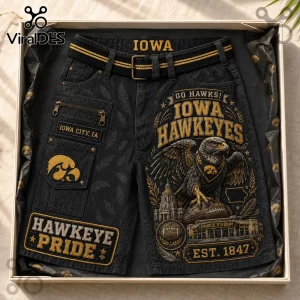 Iowa Hawkeyes Kinnick Stadium Casual Shorts in black denim featuring gold graphics, a hawk mascot, and stadium imagery.