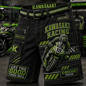 Kawasaki Racing Team black cargo shorts featuring a green motorcycle racer graphic, branded patches, and utility pockets.