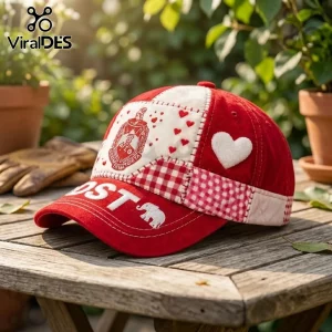 Delta Sigma Theta Patchwork Red Baseball Cap featuring white heart patches, Greek crest embroidery, and elephant emblem detail.
