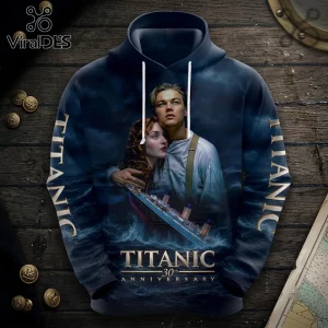 Titanic 30th Anniversary Movie Navy Blue Pullover Hoodie with graphic of Jack and Rose and the ship on a wooden background.