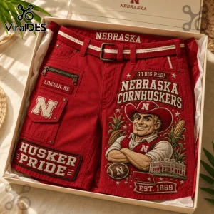 Nebraska Cornhuskers Mascot Red Casual Shorts featuring embroidered team patches, a mascot graphic, and a belt in a box.
