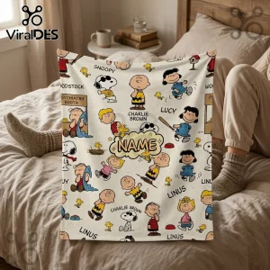 Peanuts Snoopy Personalized Fleece Blanket featuring Snoopy, Charlie Brown, Lucy, and Linus on a cream white background.